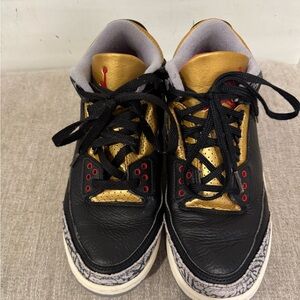 Jordan Black and Gold Sneakers with Red Accents